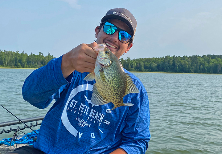 image of Jonah Blood holding nice crappie he caught on fishing charter with Jeff Sundin