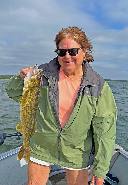 image of Suzy Klapmeir with walleye caught on lake Winnie