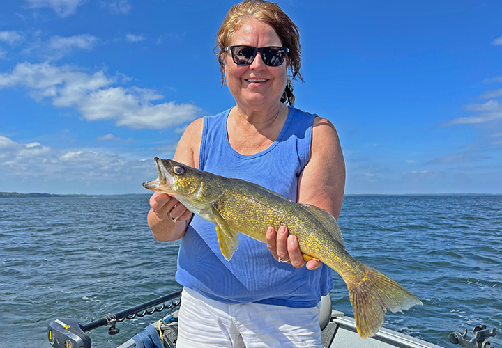 image of Suzy Klapmeir with big walleye from Lake Winnie