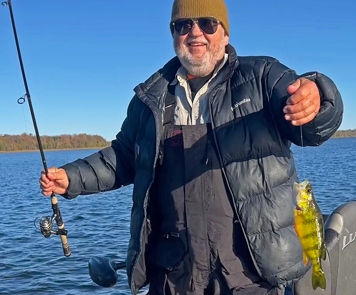 Ken Seufert wih Jumbo Perch caught on Lake Winnie