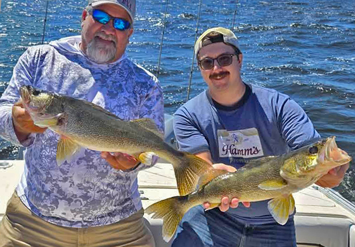 image of walleye anglers catching a double header during an Arnesen's Resort fishing charter