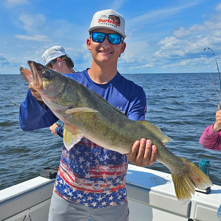 image of Avery Hangman with a huge walleye caught on Lake of the Woods fishing charter with Border Vew Lodge