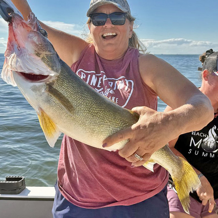 image of woman holding huge walleye caught on Lake of the Woods