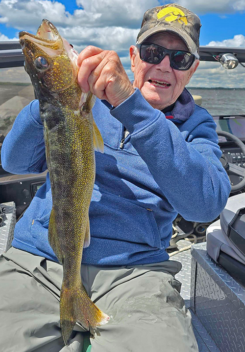 image of Lamar Popp with large walleye he caught while fishing with Justin Wiese