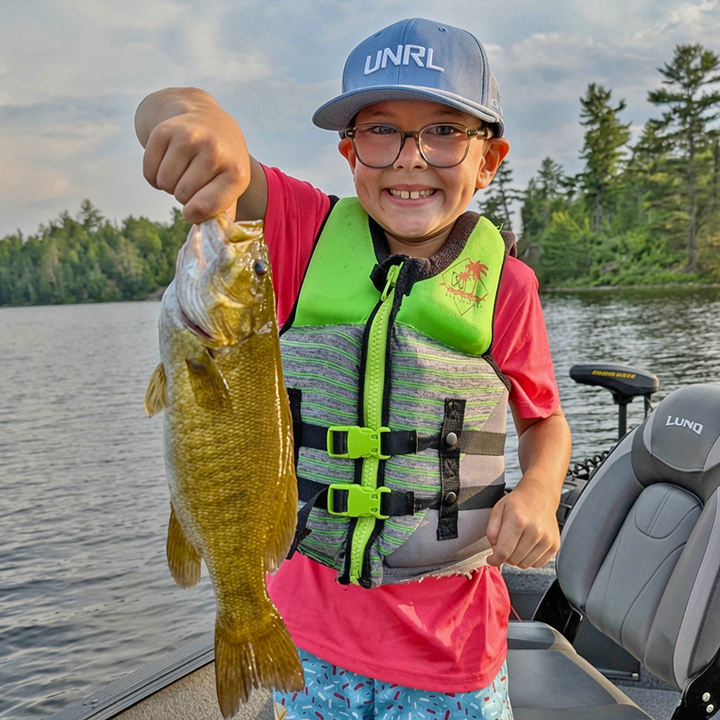 image of young angler with big smallmouth bass