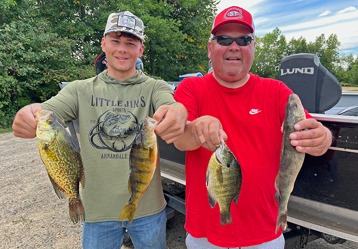 image of CJ and Jack Nilson with mixed bag of fish