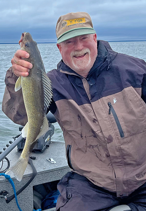 image of Larry Lashley with large walleye from Lake Winnibigoshish
