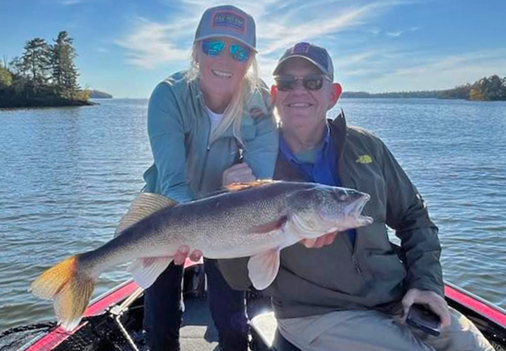 image of couple with huge walleye they caught on Lake of the Woods 